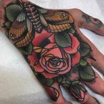 Moth and rose tattoo by Tyler Harrington #TylerHarrington #handtattoos #color #neotraditional #moth #insect #butterfly #wings #leaves #rose #rosebud #floral #flower #nature