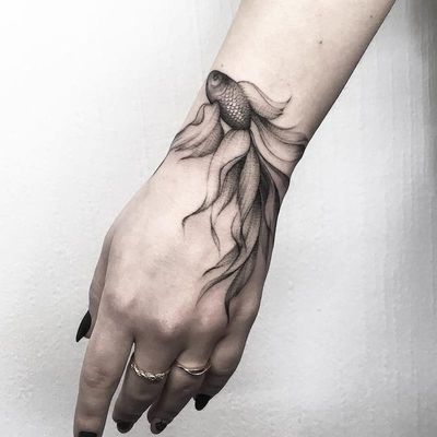 Hand tattoo by Vlada Shevchenko #VladaShevchenko #handtattoos #blackandgrey #realism #realistic #betafish #fish #scales #oceanlife #tropical