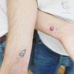 What are cooler than lovely couple tattoos?! Done by Ayhan Karadag at Ayhan Karadag Tattoo Studio #minimal #matchingtattoo #coupletattoo #rocket #planet #ayhankaradag