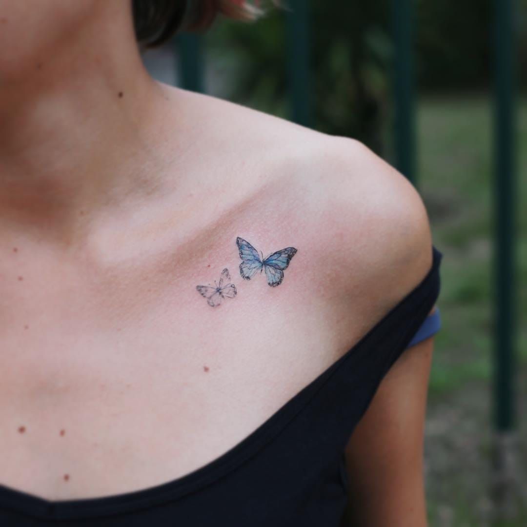 Pink Flying Butterfly Tattoo On Left Bicep