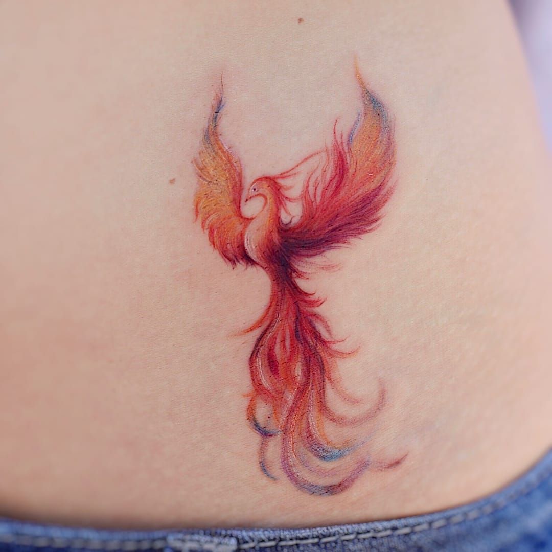 Orange Phoenix Tattoo on Woman's Arm