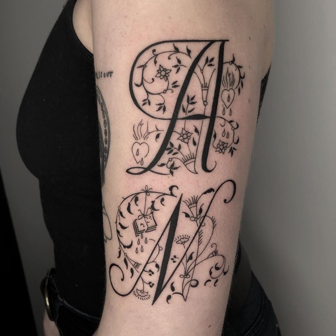 Tattoo of Letter E Alphabet tattoo  custom tattoo designs on  TattooTribescom