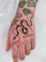 Snake hand tattoo by Sion #Sion #tattooistSion #snake #hand #flowers #peony - Top 10 Cities to Get Tattooed In #Seoul #tattooidea #tattoo #tattooart #vacation #travel #top10 #top10cities #gettattooed