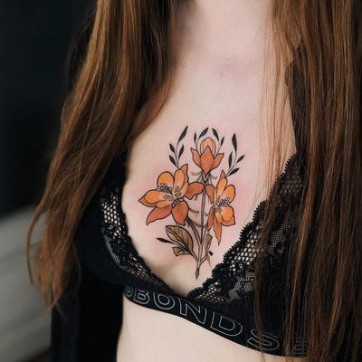 Floral tattoo by Jen Tonic #JenTonic #floraltattoos #floral #flower #flowertattoos #plants #nature #petals #neotraditional #color #chest