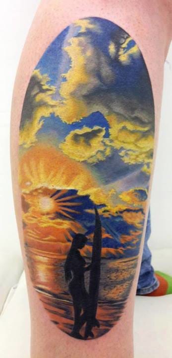 Surfers enjoy beach tattoos. By Jennifer Sterry.