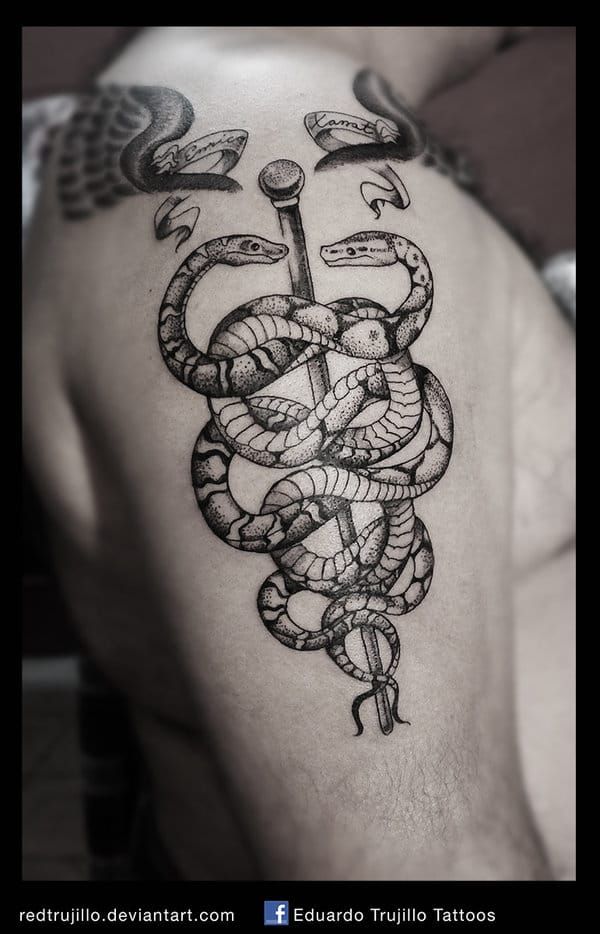 Caduceus tattoos can be intricate. Here by Eduardo Trujillo.