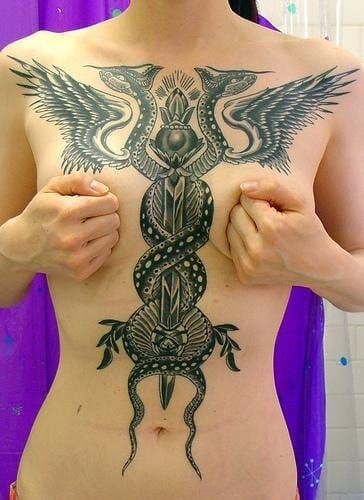 A cool torso tattoo! Could you credit the artist please?