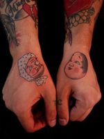 Japanese folklore has also humorous characters. Here, hand tattoos of Hyottoko and Okame. They are not Noh characters but famous dance and Japanese culture masks. By Cacau Horihana.