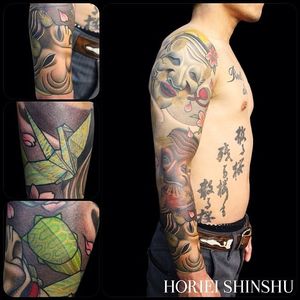 This sleeve, also by Horiei Shinshu, includes several Japanese mask tattoos.