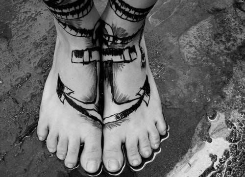 A clever placement for this tattoo, reminding to its owner not to sink !