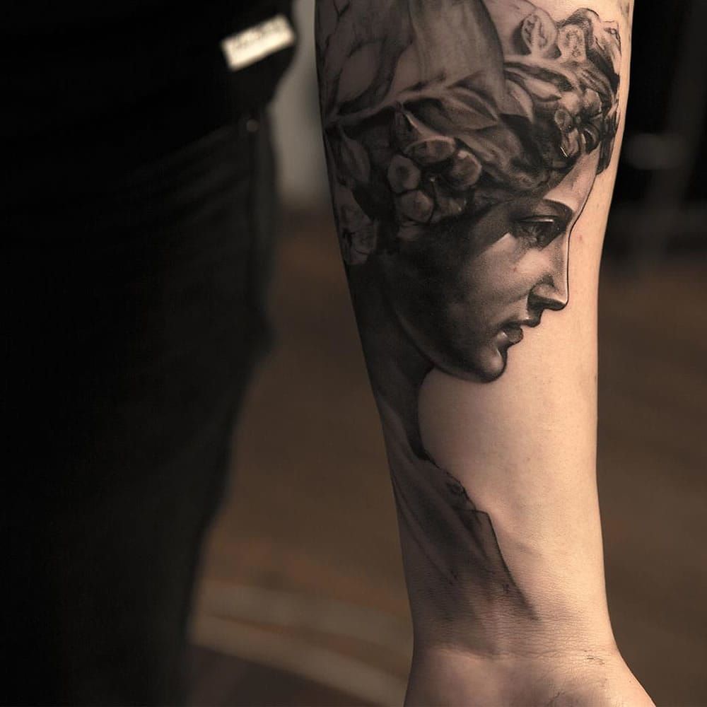 Artist Places Tattooed Marble Sculptures in Historic Italian Town