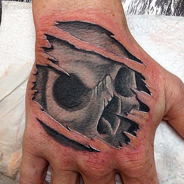 Cool hand tattoo by Jess Tattoos.