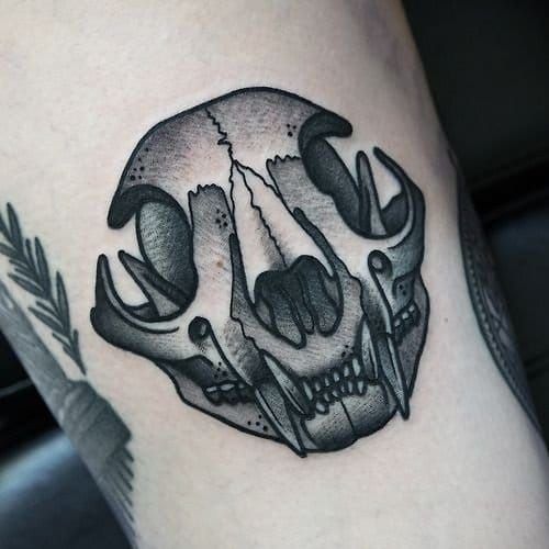 Cat skull tattoo by Philip Yarnell