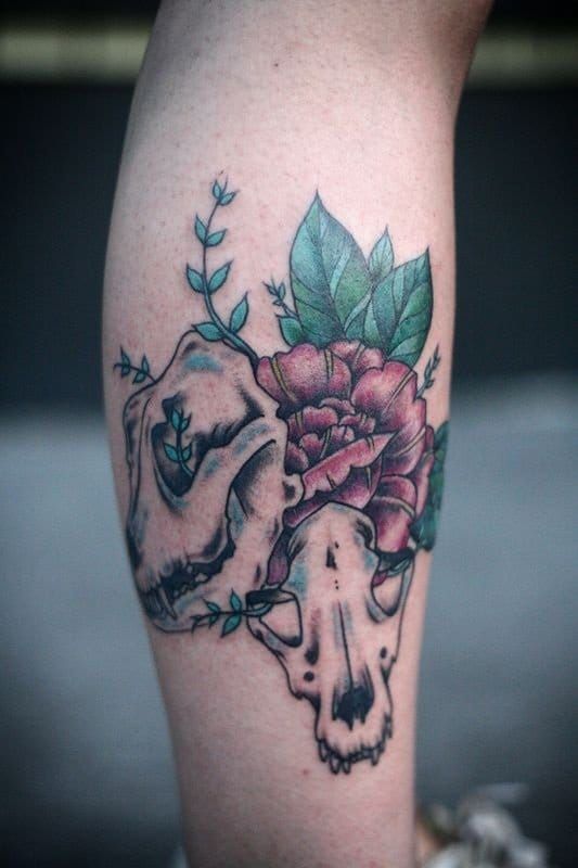 Dog skull tattoo by Alice Carrier