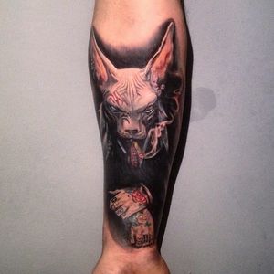 Creepy cat tattoo