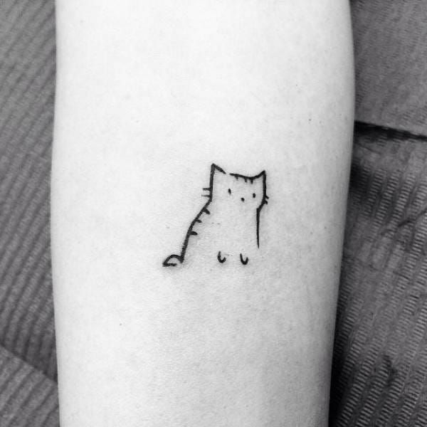 Cat tattoo in fine line located on the bicep