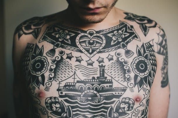 Black and grey traditional chest tattoo by Matthew Houston