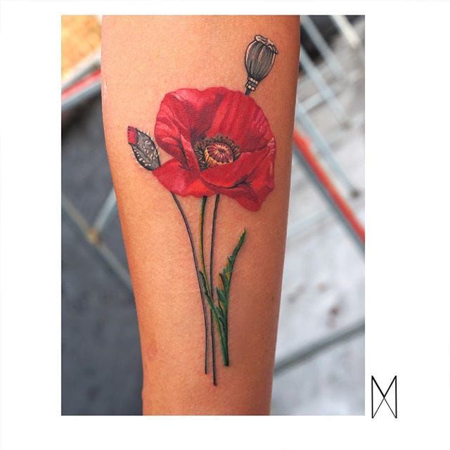 Orange rose and poppy tattoos on the left inner