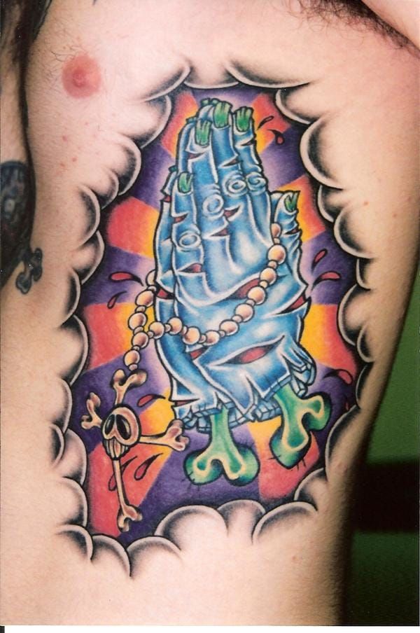 Awesome colorful piece by Megan Massacre #prayinghandstattoo #prayinghands #meganmassacre