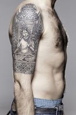 Intricacy in moderation makes a beautiful Buddha tattoo. Love the patterns in this half-sleeve tattoo! #buddha