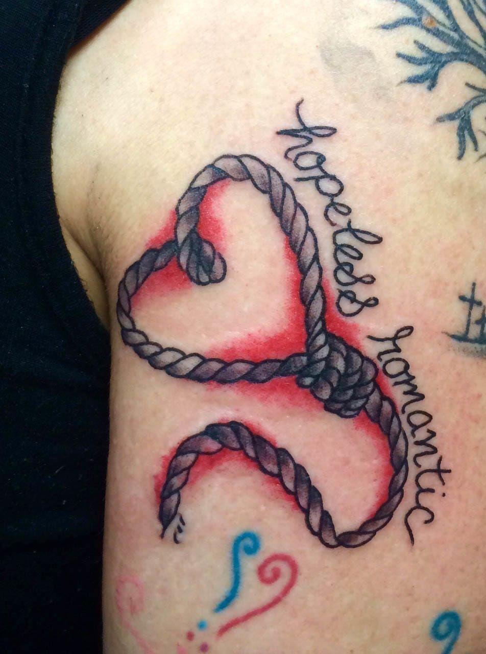 Heart shaped noose tattoo