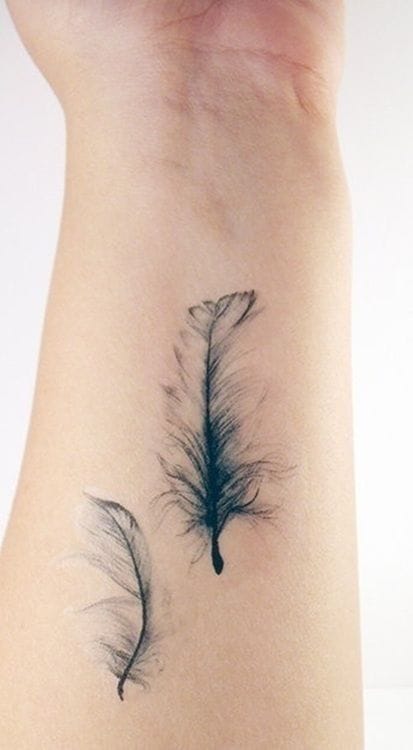 Delicate watercolor feathers on the wrist, found on weheartit.com #femininetattoo #femininetattoos