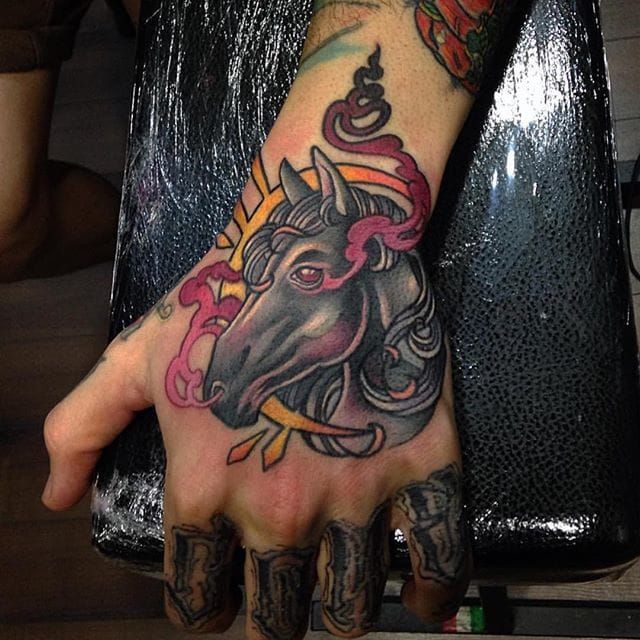 Hand tattoo by Enrik Gispert.
