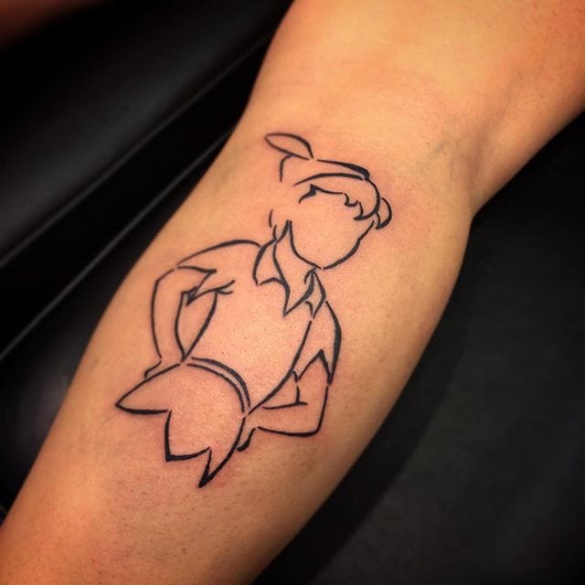 Minimalistic style Peter Pan tattoo located on the