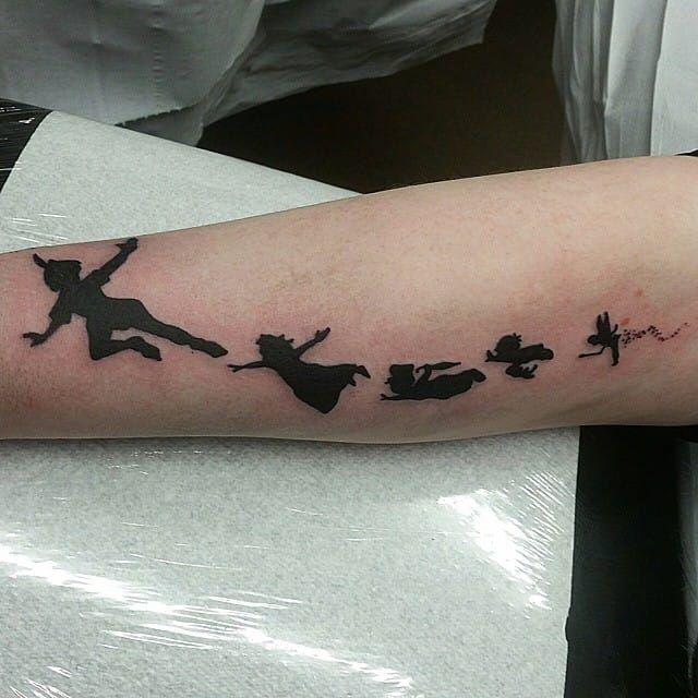 Peter Pan minimalist arm tattoo by Nicole Cairns