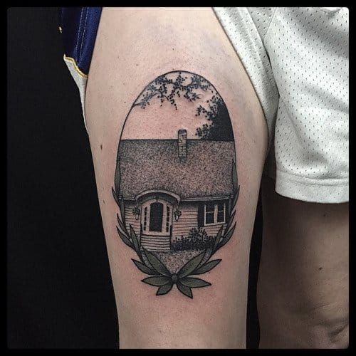 Black and grey floating house tattoo on the left inner
