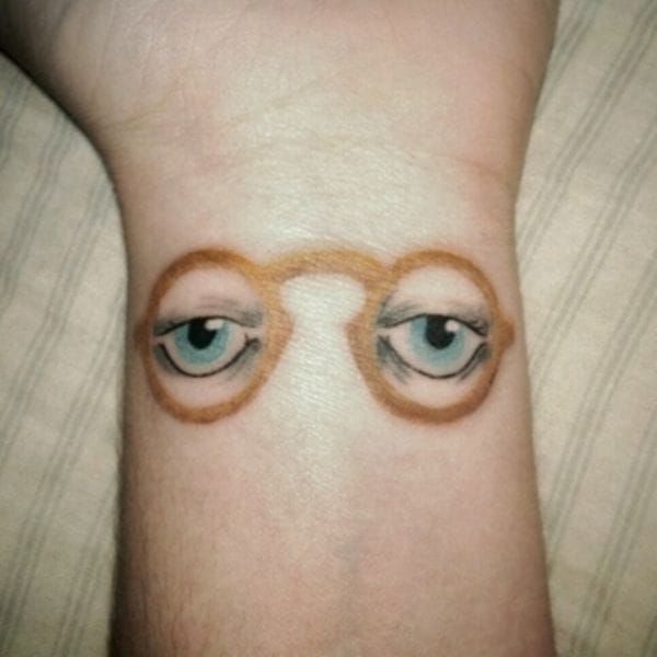 Beautiful tattoo of Dr. T.j. Ecklegberge's eyes from The Great Gatsby by F. Scott Fitzgerald.