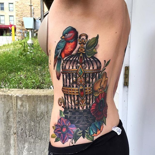 Lizards Skin Tattoos  This pleasing tattoo of bird freed from the cage  represents freedom  courage  will to fight  admiring personality and  strength  This tattoo is done by