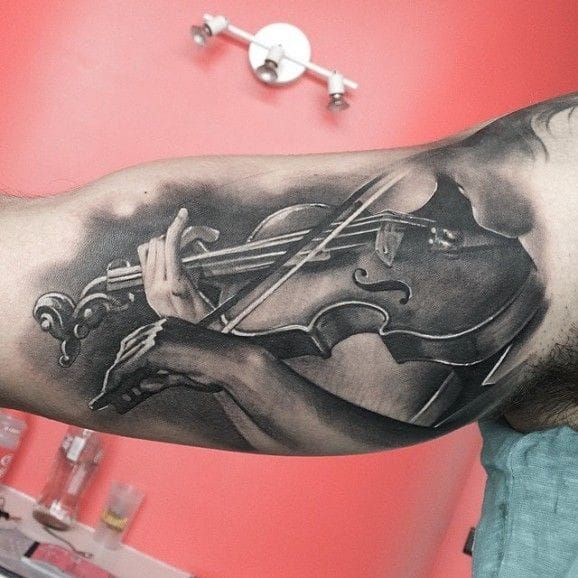 Lovely black and grey violin tattoo by Matteo Pasqualin.