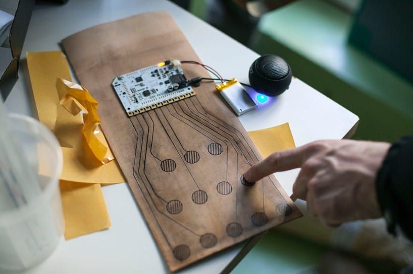 Bare conductive electric ink was used to tattoo electric circuits into the leather iPad cover.