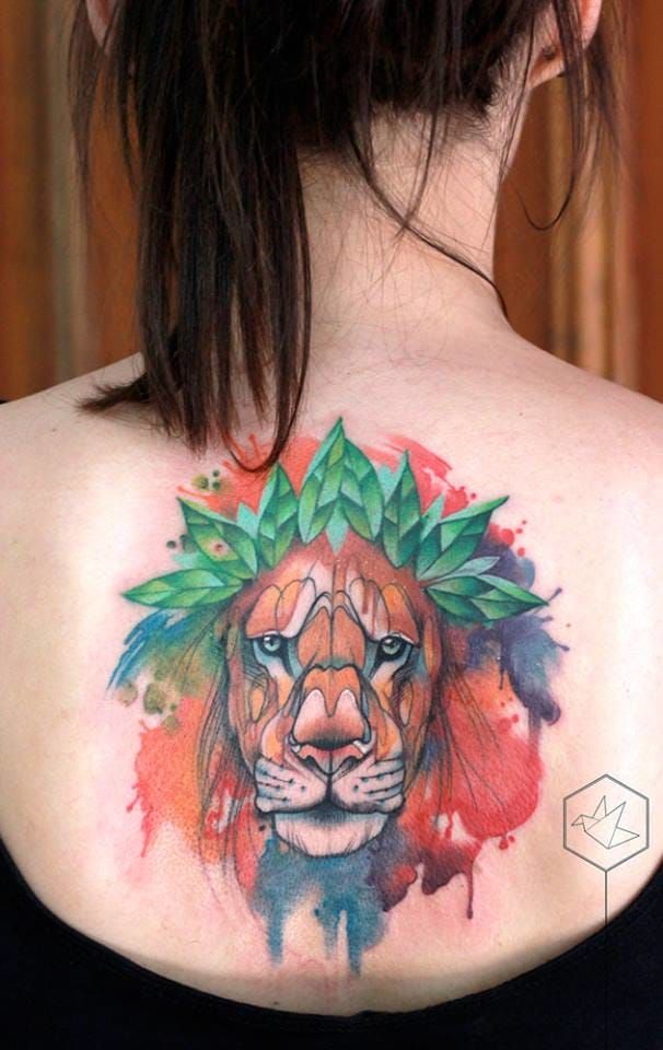 Pretty lion back tattoo.