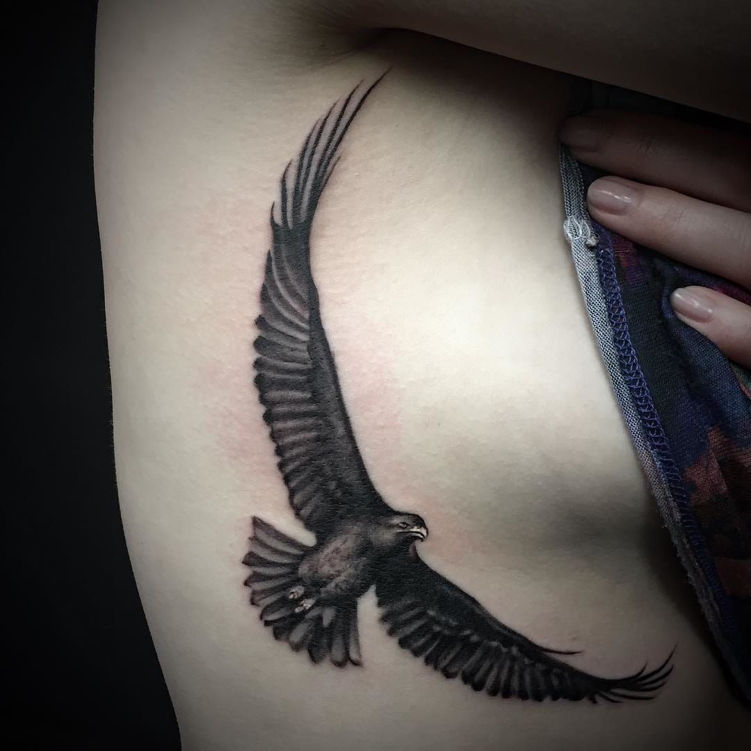 Bold sideboob eagle tattoo by Antonio Gabriele