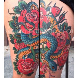 Great traditional style snake rose tattoo