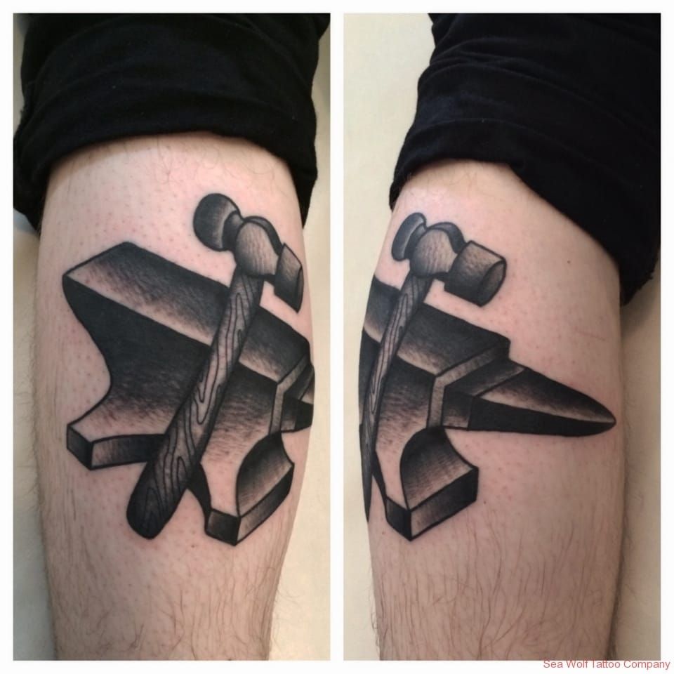 Cross stitch anvil tattoo on the leg