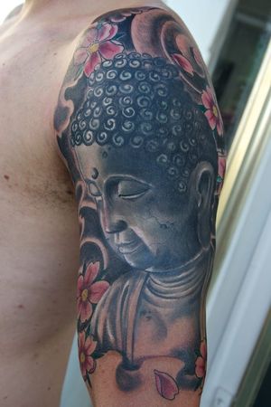 Buddha face tattoo by Heinz Graynd