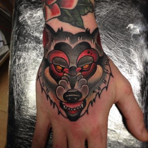 Solid wolf head on hand