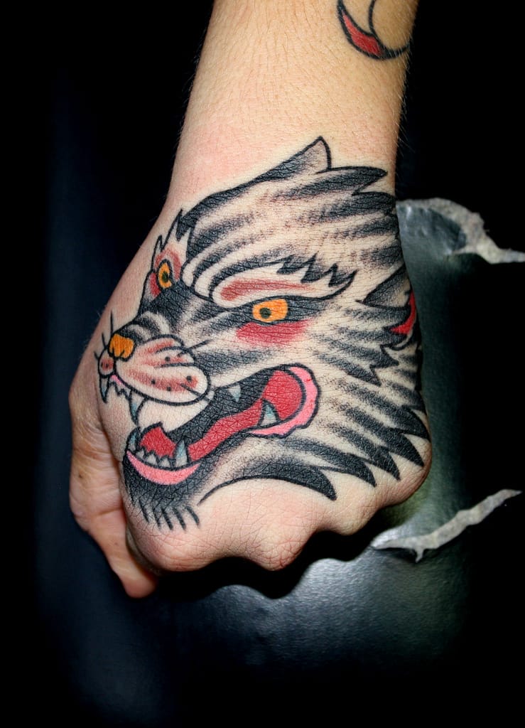 Wold hand tattoo by Myke Chambers