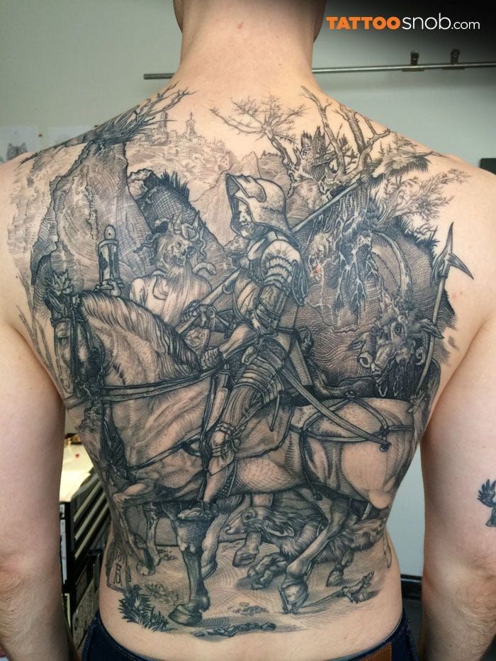 The famous engraving of Dürer, the knight and the Death, really popular among blackwork artists. Here by Kane Melbourne.