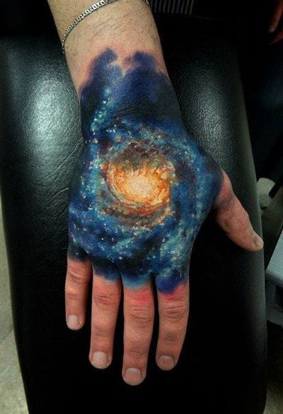 I have my very own galaxy on my hand, he says... Tattoo by Insane.