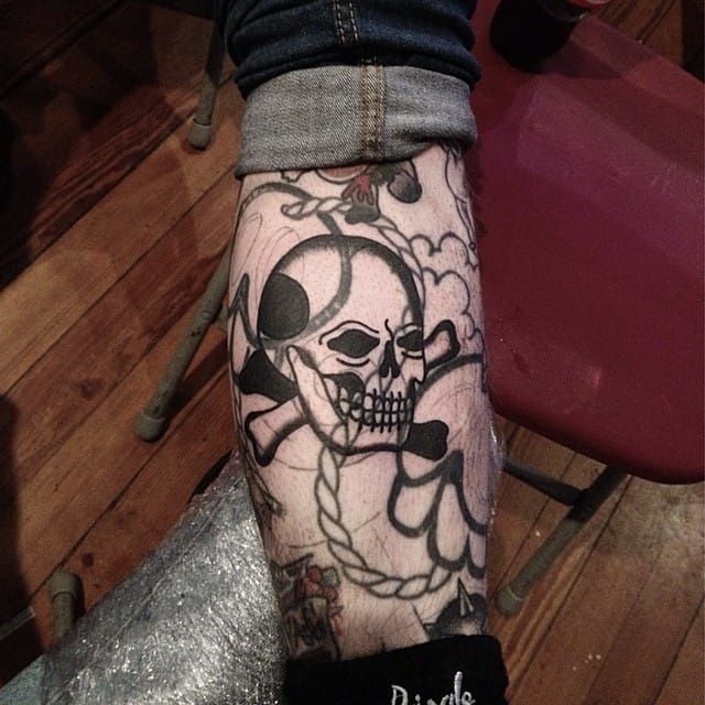 Blast Over Crossbones Tattoo by Matty D’Arienzo