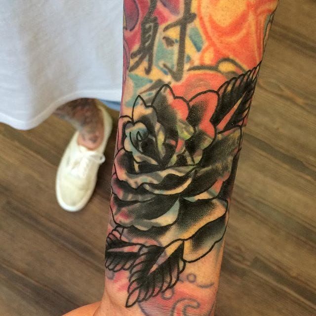 Blast Over Flower Tattoo by Charles Daniel Holmes