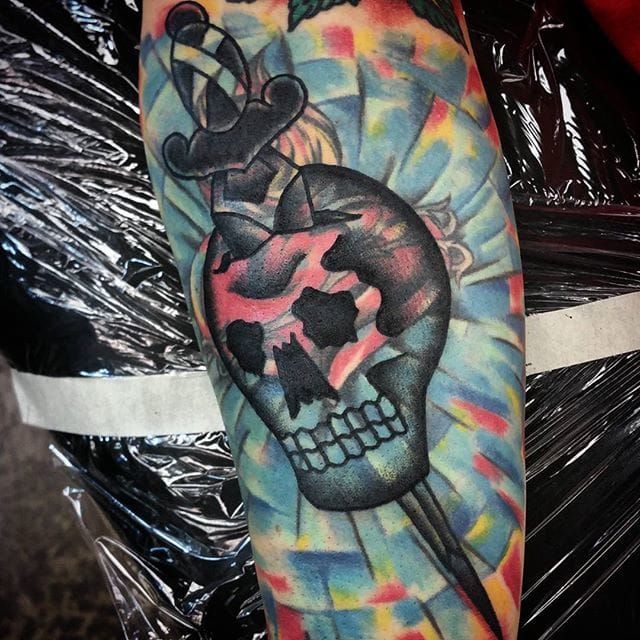 Blast Over Skull and Dagger Tattoo by Travis Stanley