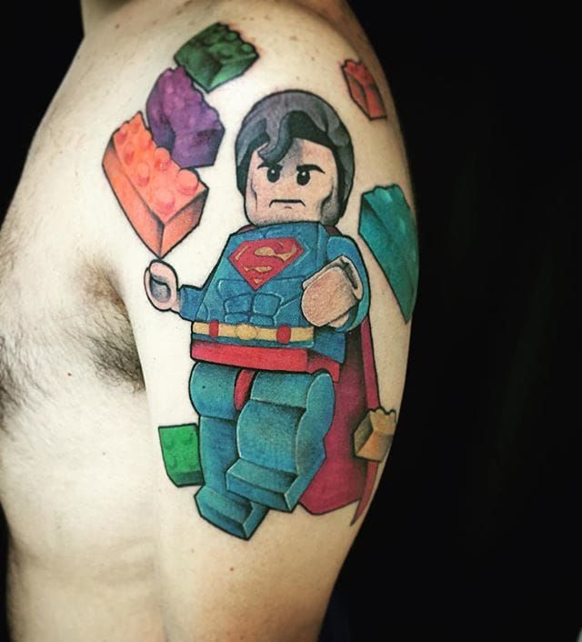 Funny superman tattoo on ribs of a girl done by Michael Carrington  r superman
