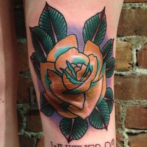 Rose knee tattoo