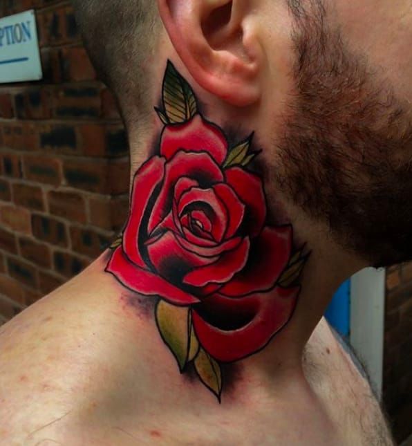 Traditional blue rose tattoo on the left side of the
