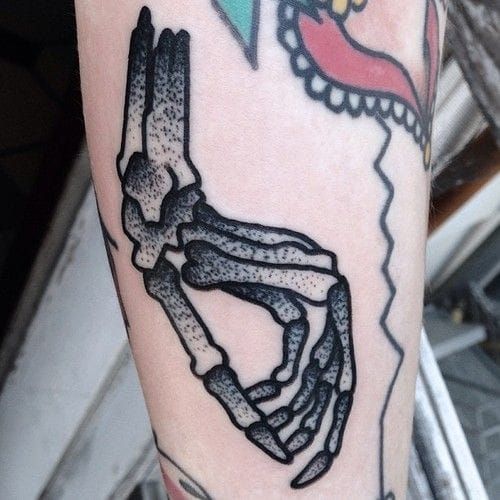 18 Unsettling Skeleton Hand Tattoos  Tattoodo